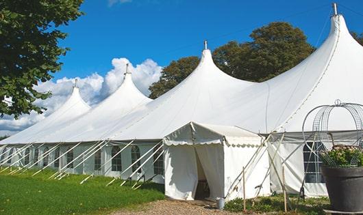 a line of sleek and modern portable toilets ready for use at an upscale corporate event in Gwynn Oak, MD